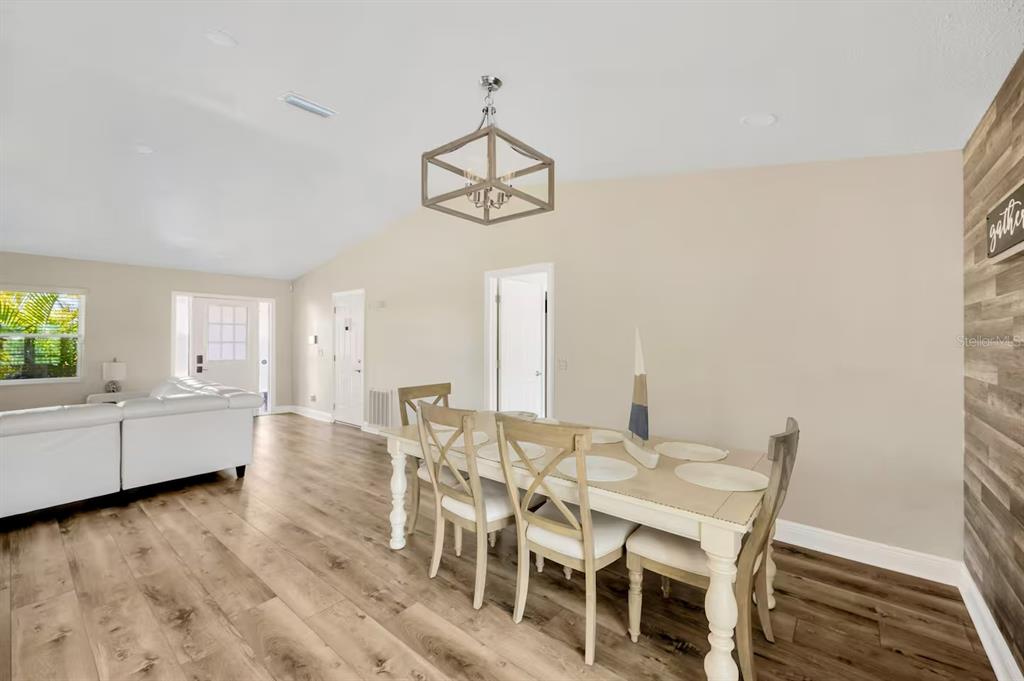 721 Eagle Lane Apollo Beach, FL 33572 - Photo 14 of 48 a view of a dining room with furniture window and wooden floor