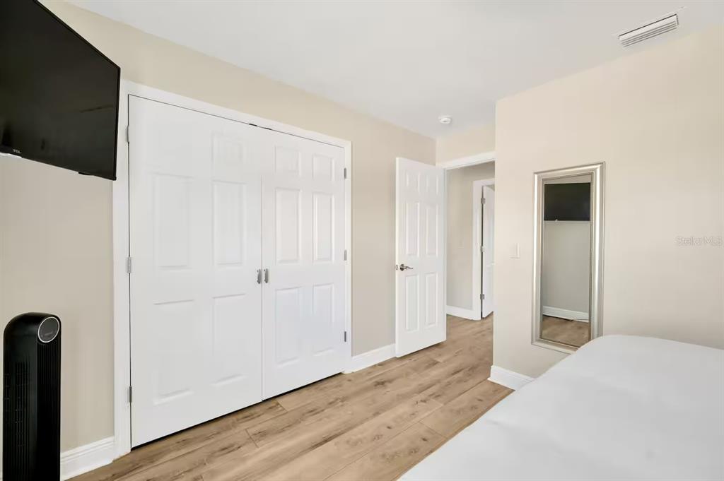 721 Eagle Lane Apollo Beach, FL 33572 - Photo 28 of 48 a bedroom with a bed and hallway