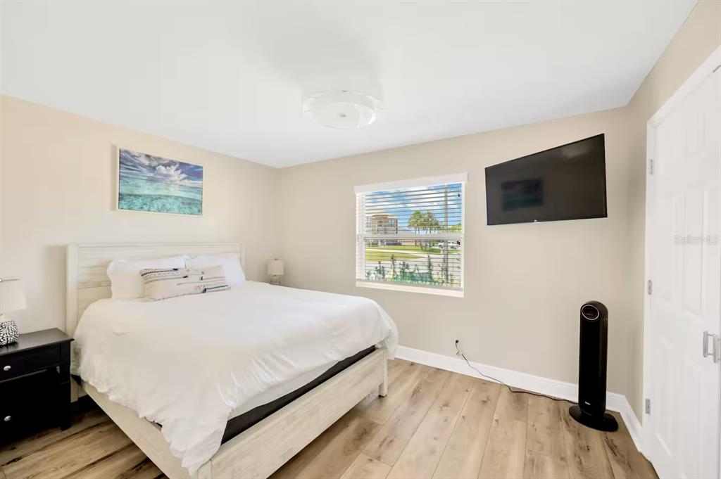 721 Eagle Lane Apollo Beach, FL 33572 - Photo 29 of 48 a bedroom with a bed and a flat screen tv