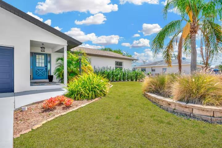 721 Eagle Lane Apollo Beach, FL 33572 - Photo 4 of 48 a view of a backyard with a garden