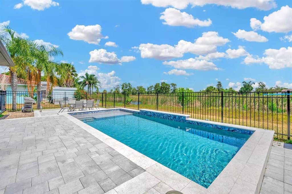 721 Eagle Lane Apollo Beach, FL 33572 - Photo 42 of 48 a view of a lake with a building in the background