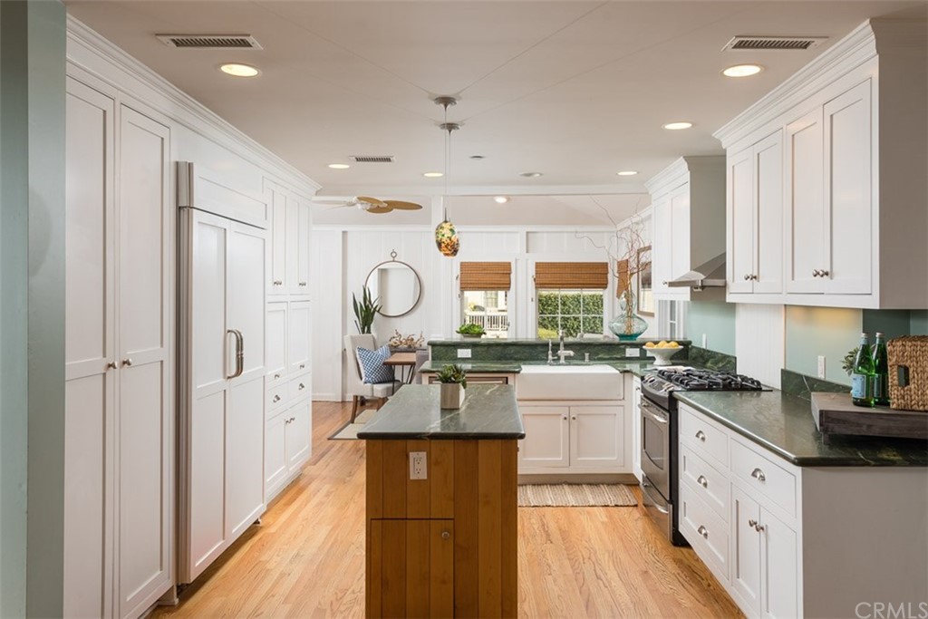 107 High Drive Laguna Beach, CA 92651 - Photo 18 of 35 a kitchen with cabinets a sink and appliances
