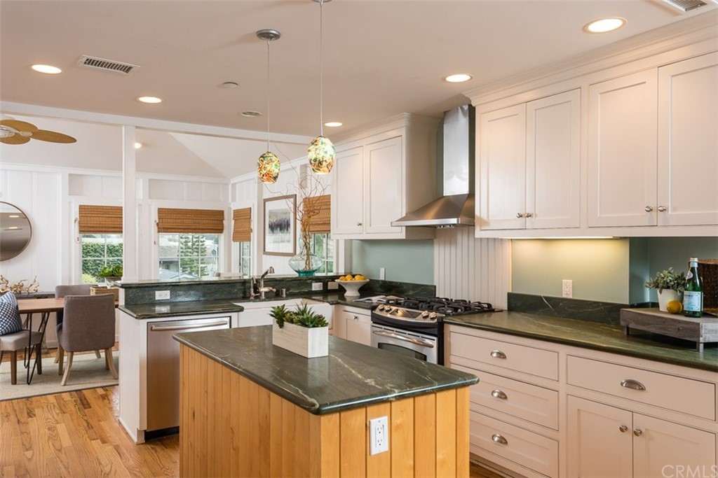 107 High Drive Laguna Beach, CA 92651 - Photo 19 of 35 a kitchen with stainless steel appliances granite countertop a sink a stove and cabinets