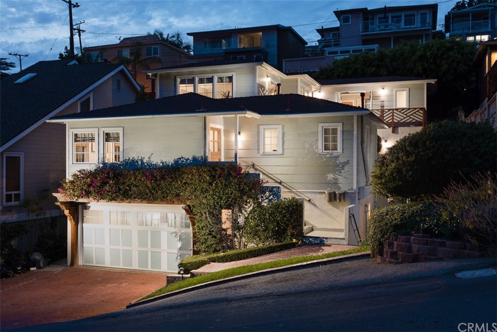 107 High Drive Laguna Beach, CA 92651 - Photo 2 of 35 a front view of a house with a yard