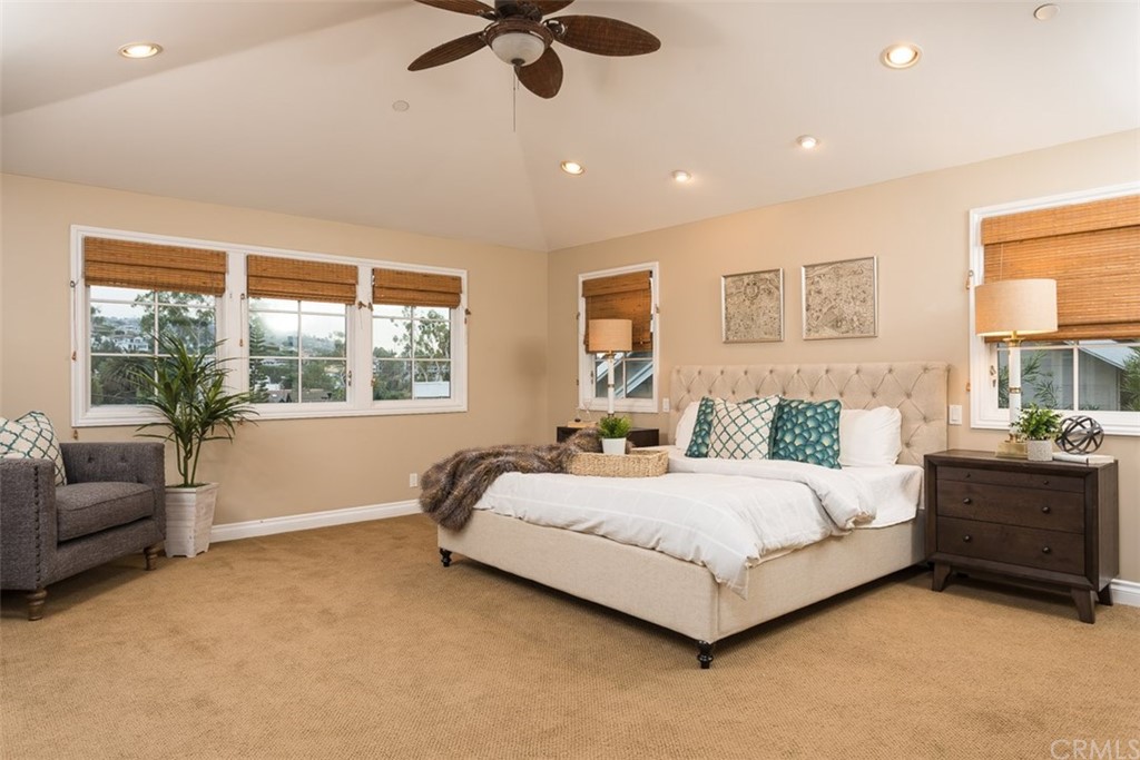 107 High Drive Laguna Beach, CA 92651 - Photo 27 of 35 a bedroom with a bed couch and window