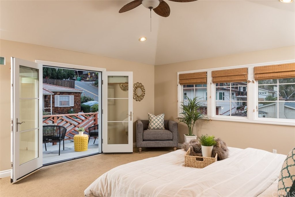 107 High Drive Laguna Beach, CA 92651 - Photo 28 of 35 a bedroom with furniture and a potted plant