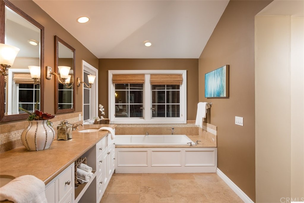 107 High Drive Laguna Beach, CA 92651 - Photo 30 of 35 a spacious bathroom with a tub sink and mirror