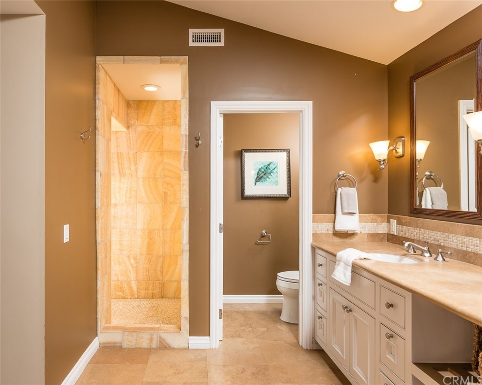 107 High Drive Laguna Beach, CA 92651 - Photo 31 of 35 a spacious bathroom with a double vanity sink a mirror and a shower