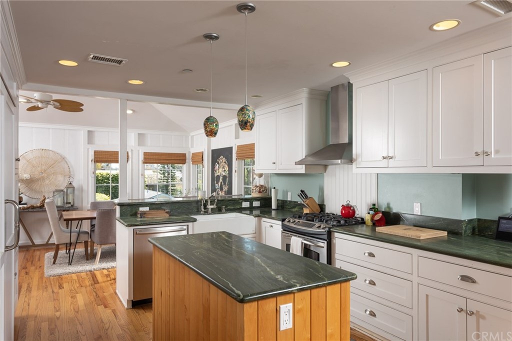 107 High Drive Laguna Beach, CA 92651 - Photo 5 of 35 a kitchen with stainless steel appliances granite countertop a sink a stove and cabinets