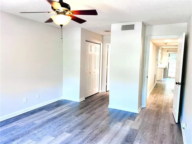 a view of a livingroom with wooden floor