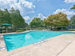 a view of a garden and basketball court