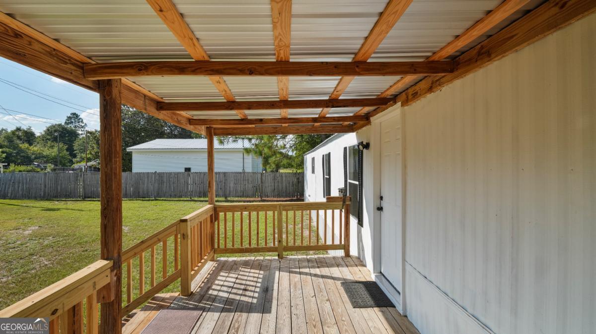 50 Sangster Road Jesup, GA 31545 - Photo 11 of 22 a view of balcony with wooden floor