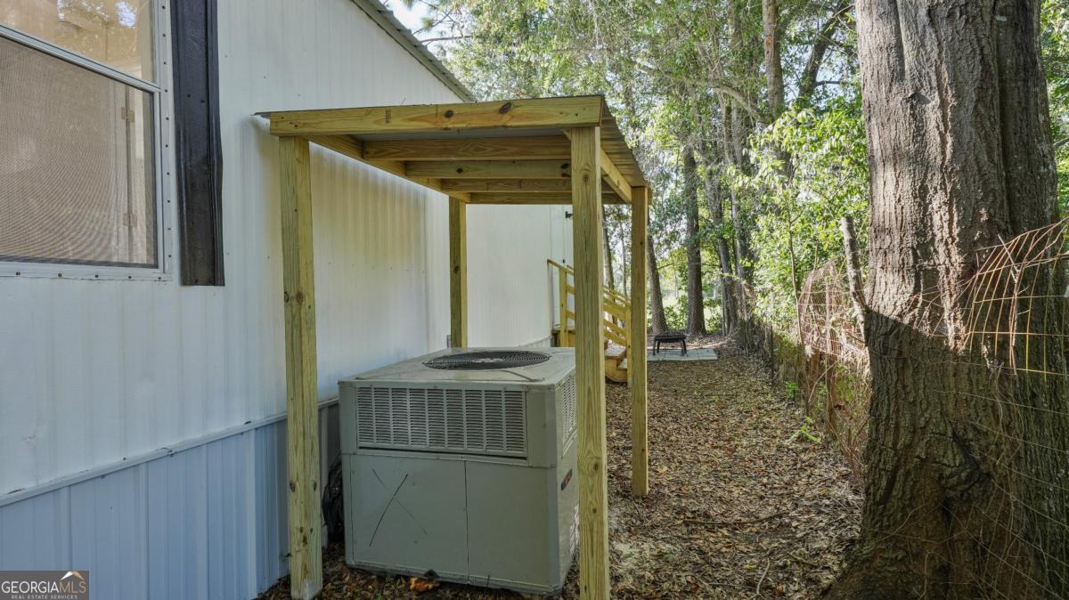 50 Sangster Road Jesup, GA 31545 - Photo 22 of 22 a bathroom with a shower and a sink