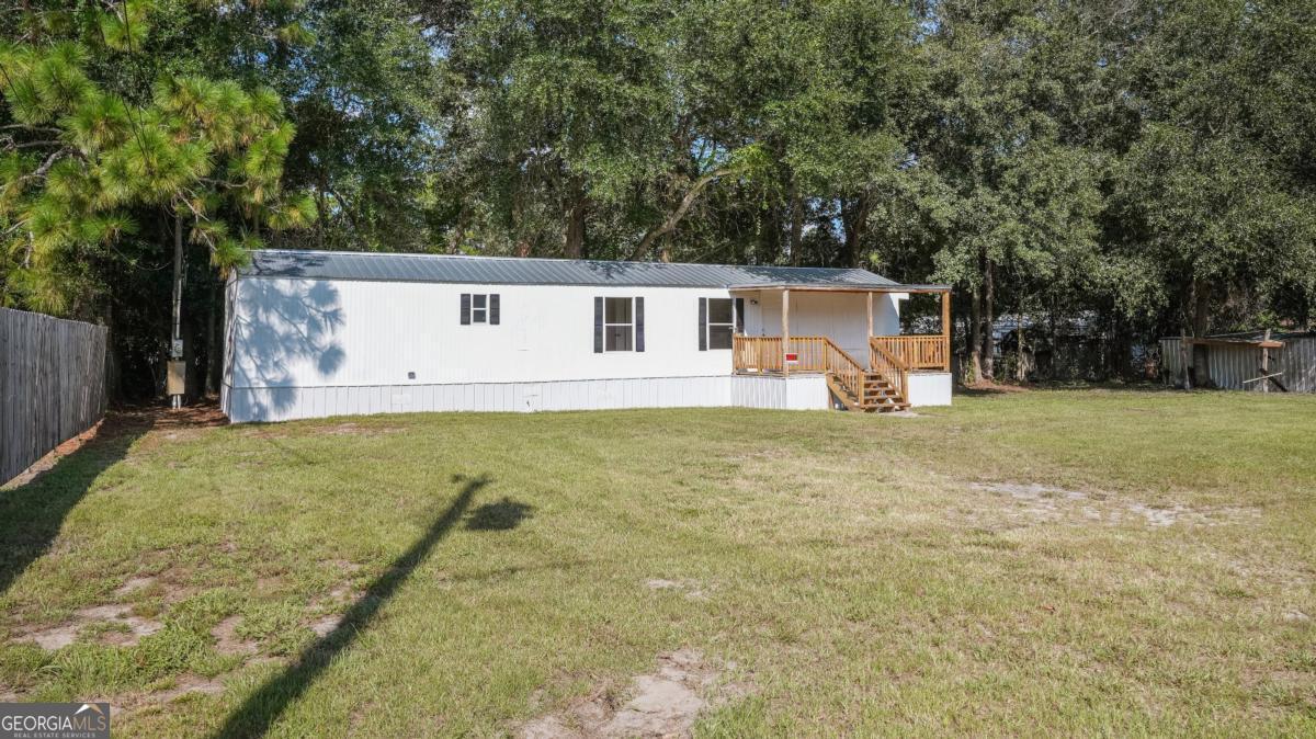 50 Sangster Road Jesup, GA 31545 - Photo 6 of 22 a view of a house with a yard