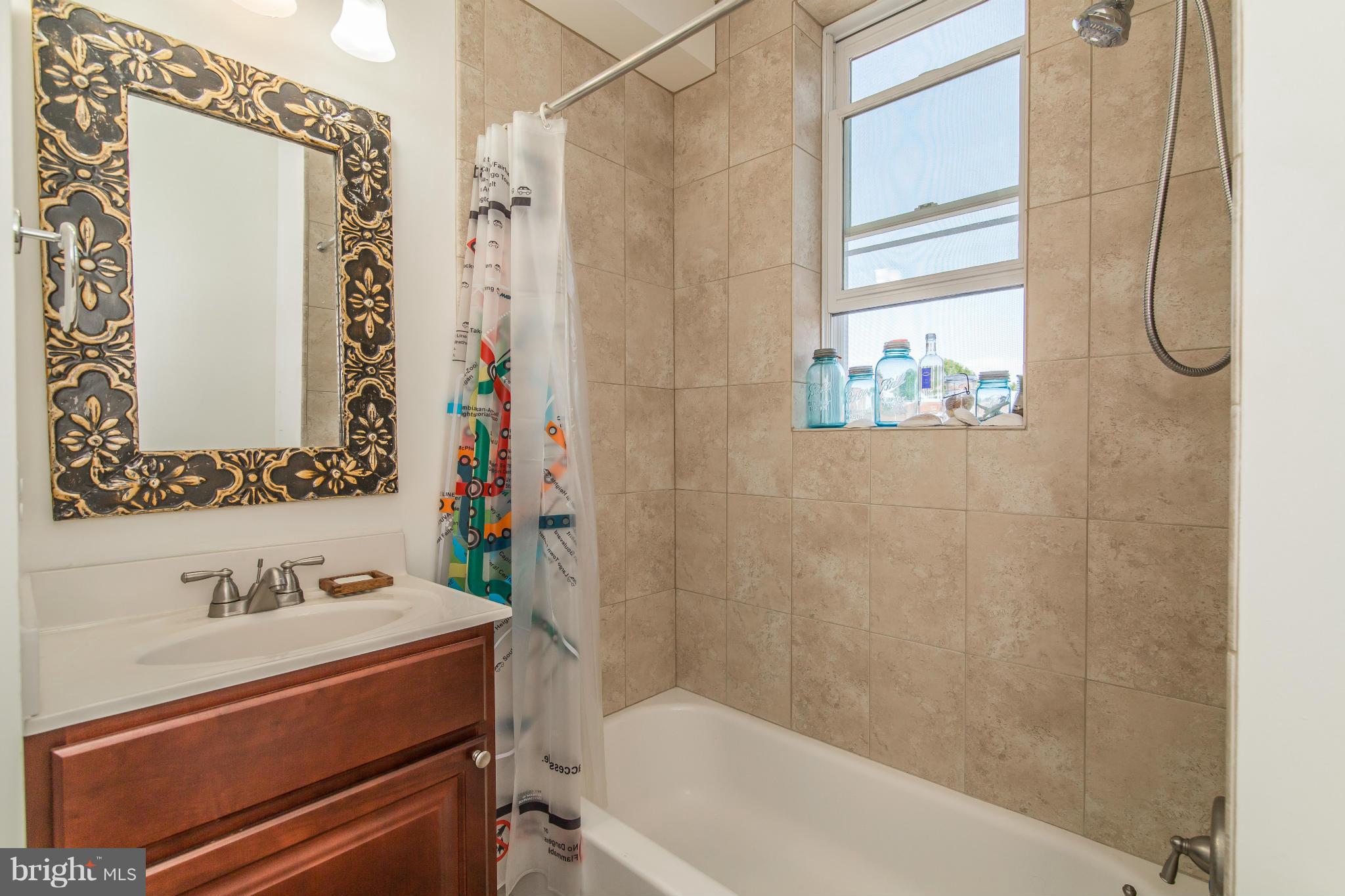 1849 3rd Street Northwest Washington, DC 20001 - Photo 16 of 23 a bathroom with a sink and a mirror