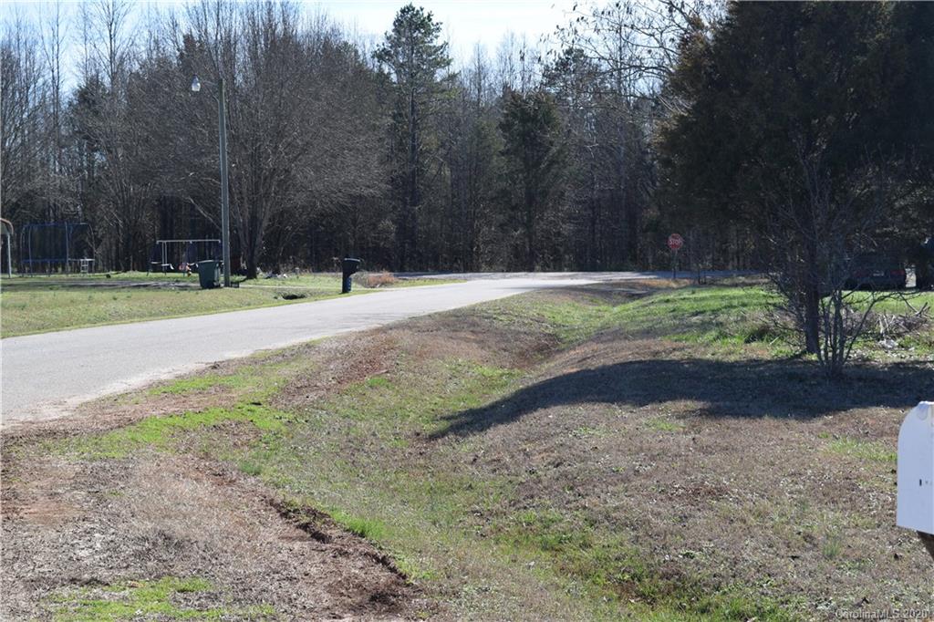 145 Rithmetic Road, Unit 75 Salisbury, NC 28147 - Photo 3 of 13 a view of a yard with plants and trees
