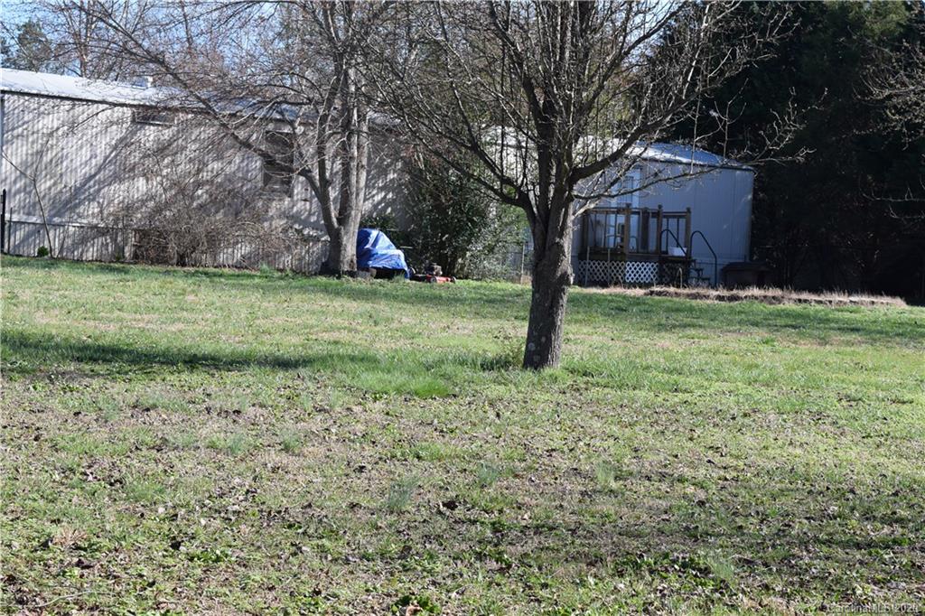 145 Rithmetic Road, Unit 75 Salisbury, NC 28147 - Photo 8 of 13 a backyard of a house with lots of green space
