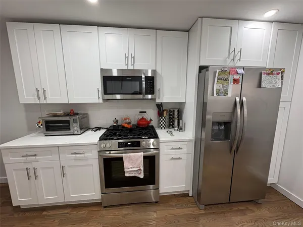 a kitchen with sink cabinets and window