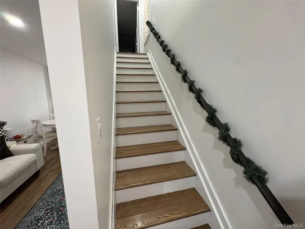 a bedroom with a bed and a mirror