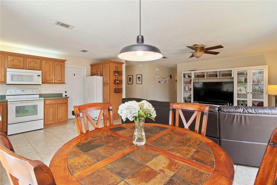 22244 Southwest 64th Terrace Boca Raton, FL 33428 - Photo 8 of 25 a dining room with furniture and window