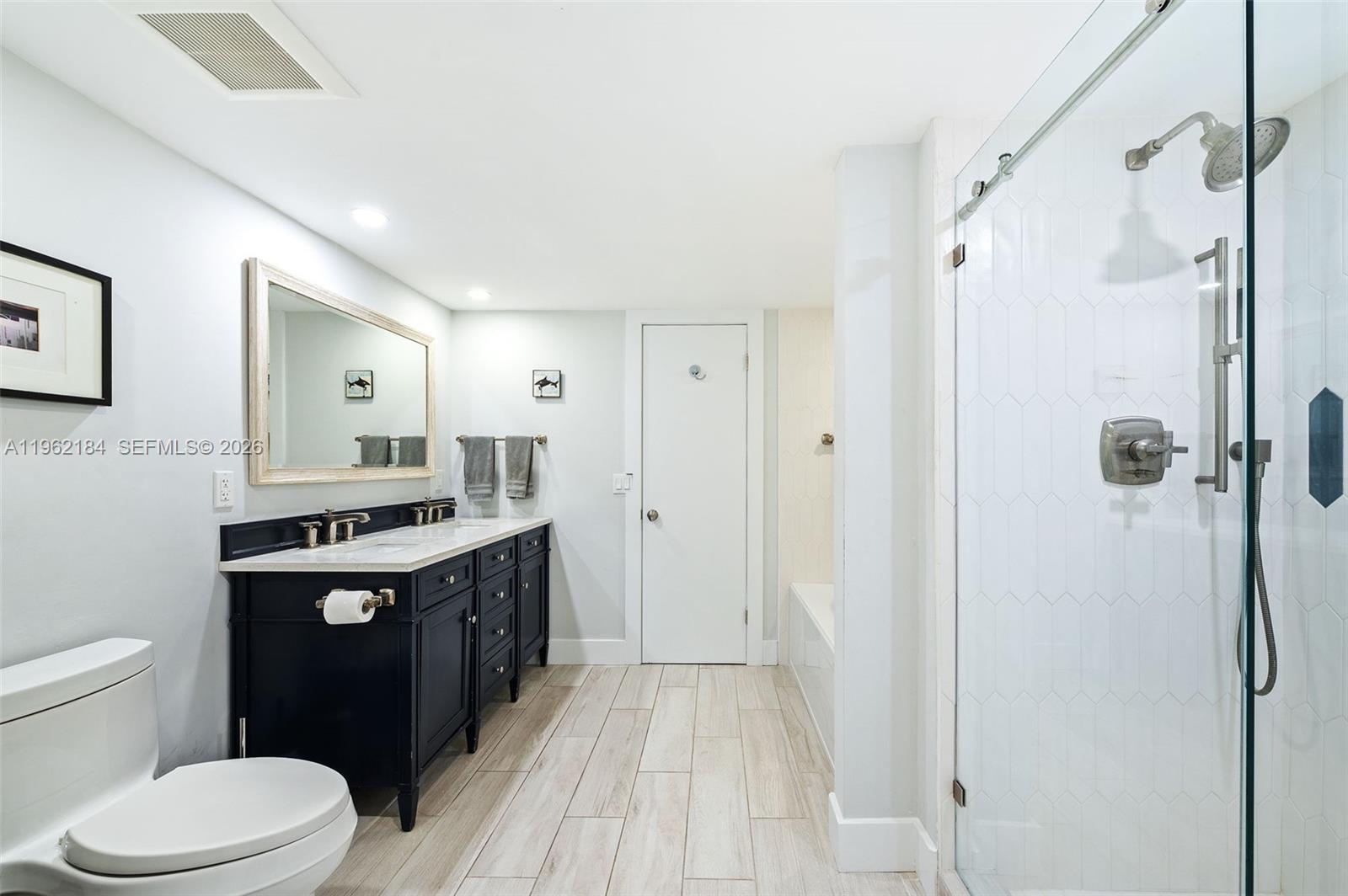 600 Grapetree Drive, Unit 3DS Key Biscayne, FL 33149 - Photo 12 of 33 a bathroom with a granite countertop sink toilet and shower
