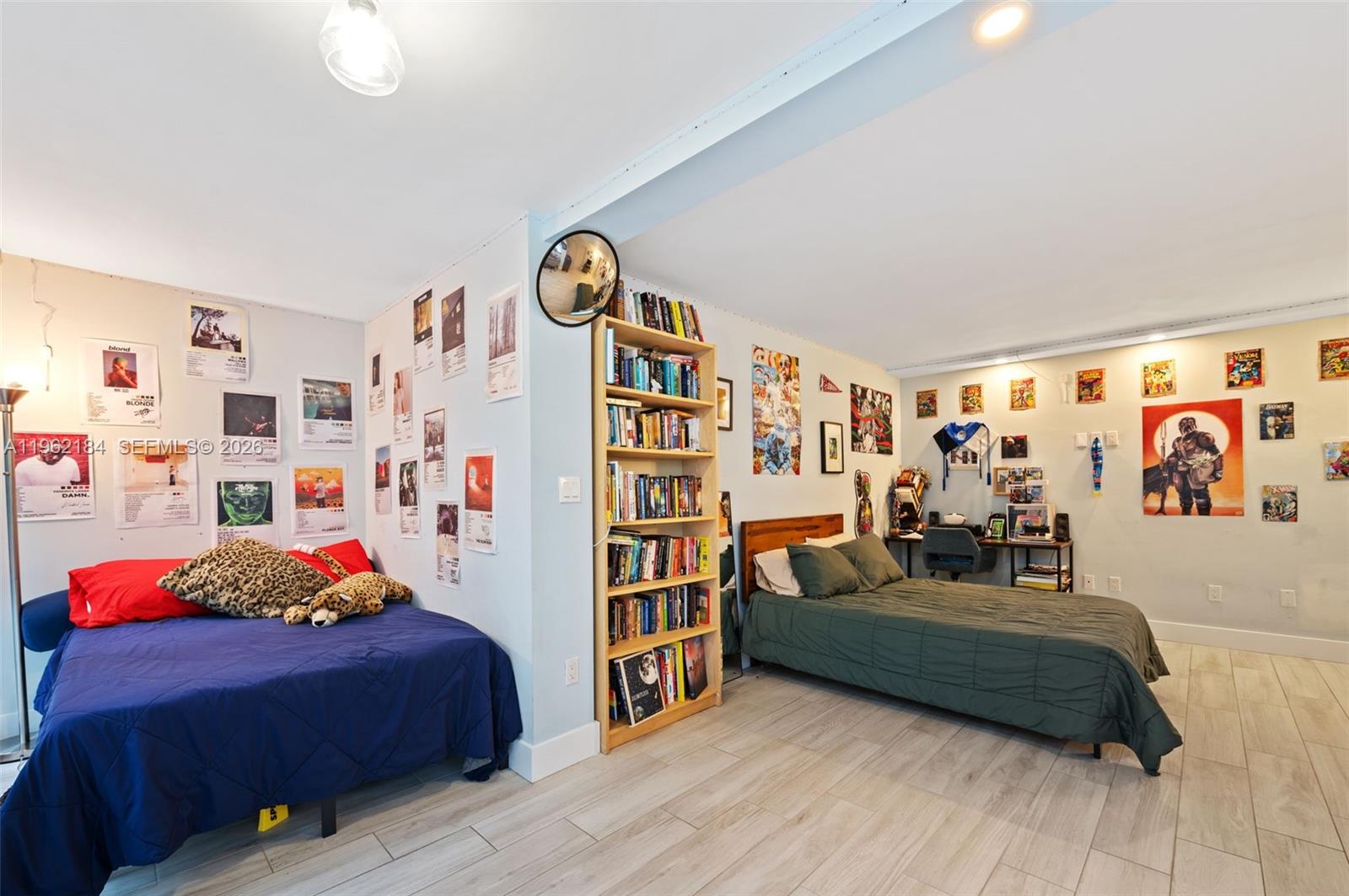 600 Grapetree Drive, Unit 3DS Key Biscayne, FL 33149 - Photo 15 of 33 a bedroom with furniture and a book shelf