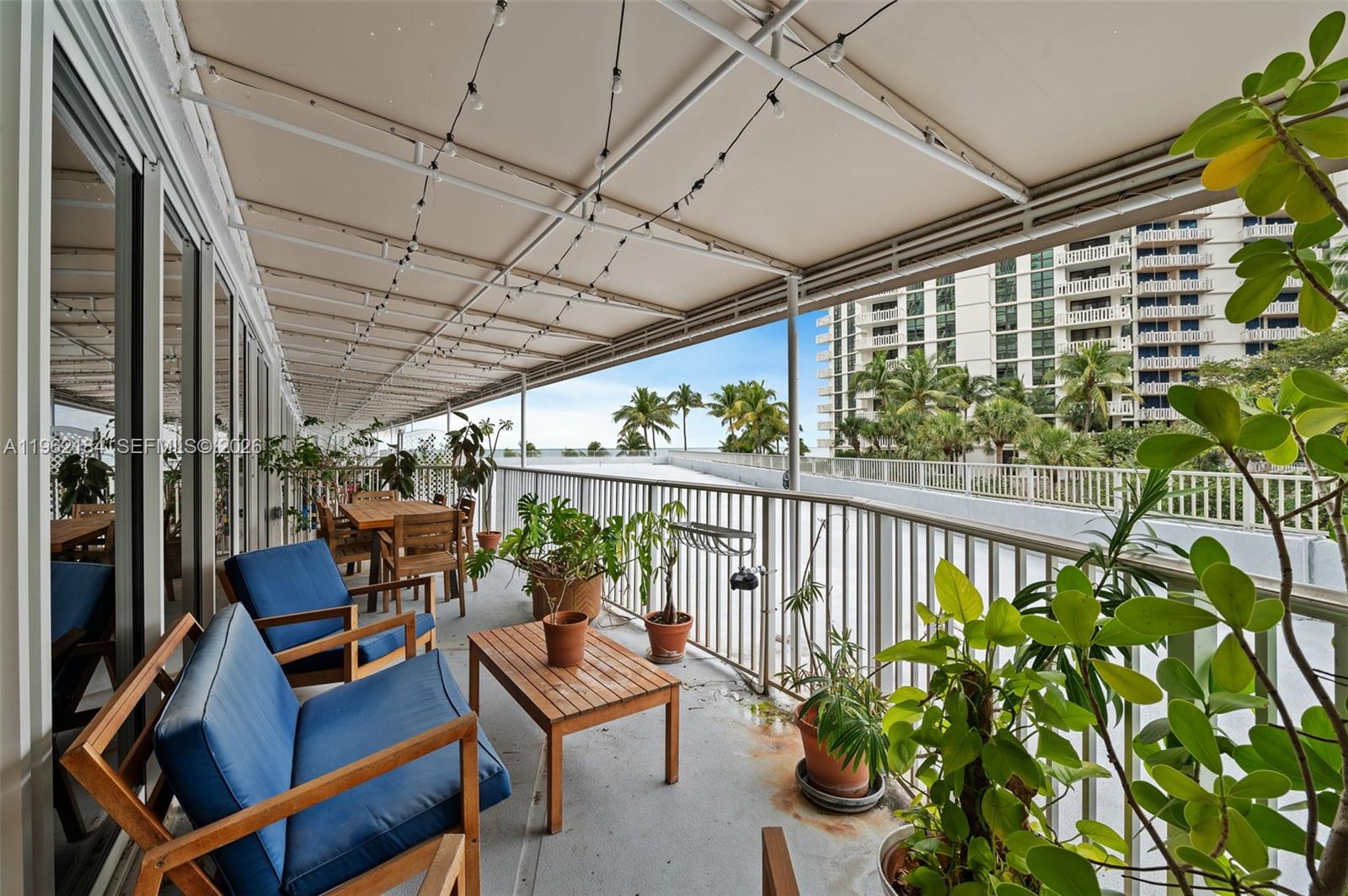 600 Grapetree Drive, Unit 3DS Key Biscayne, FL 33149 - Photo 18 of 33 a view of a chairs and table in a patio