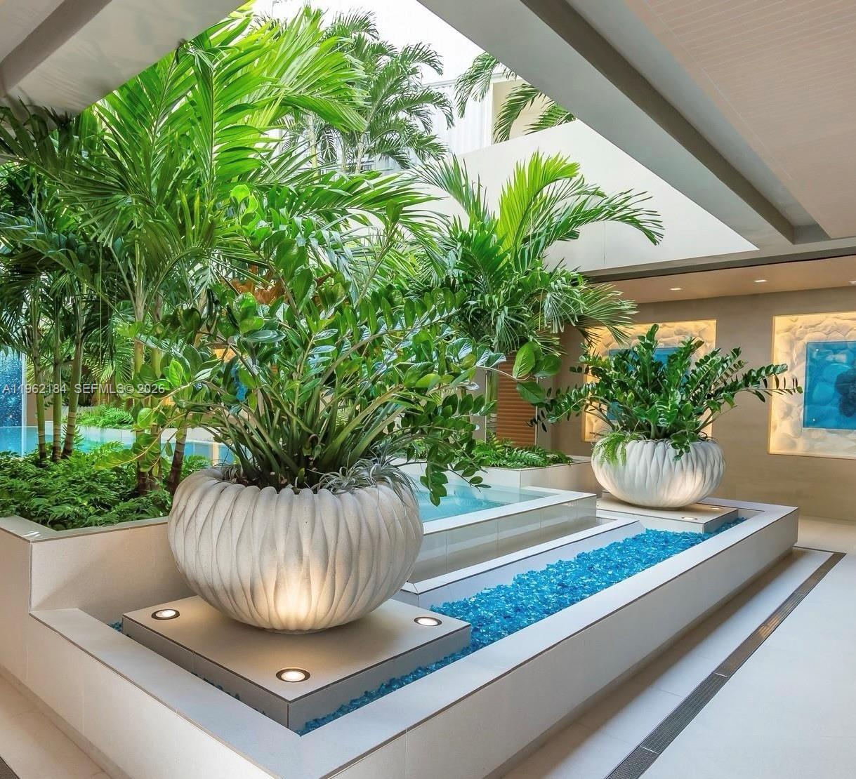 600 Grapetree Drive, Unit 3DS Key Biscayne, FL 33149 - Photo 22 of 33 a vase of flowers sitting on a floor