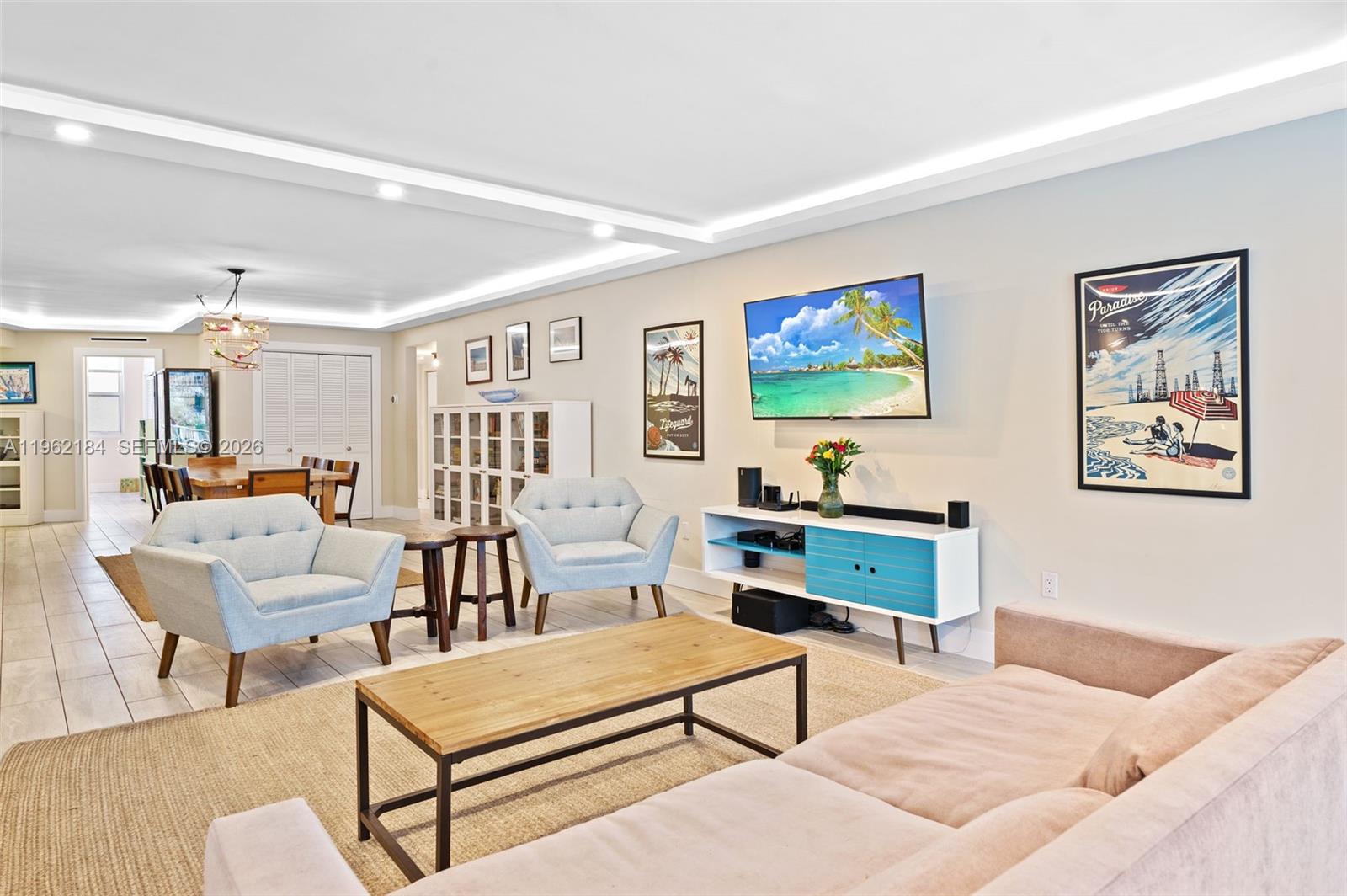 600 Grapetree Drive, Unit 3DS Key Biscayne, FL 33149 - Photo 4 of 33 a living room with furniture and a flat screen tv