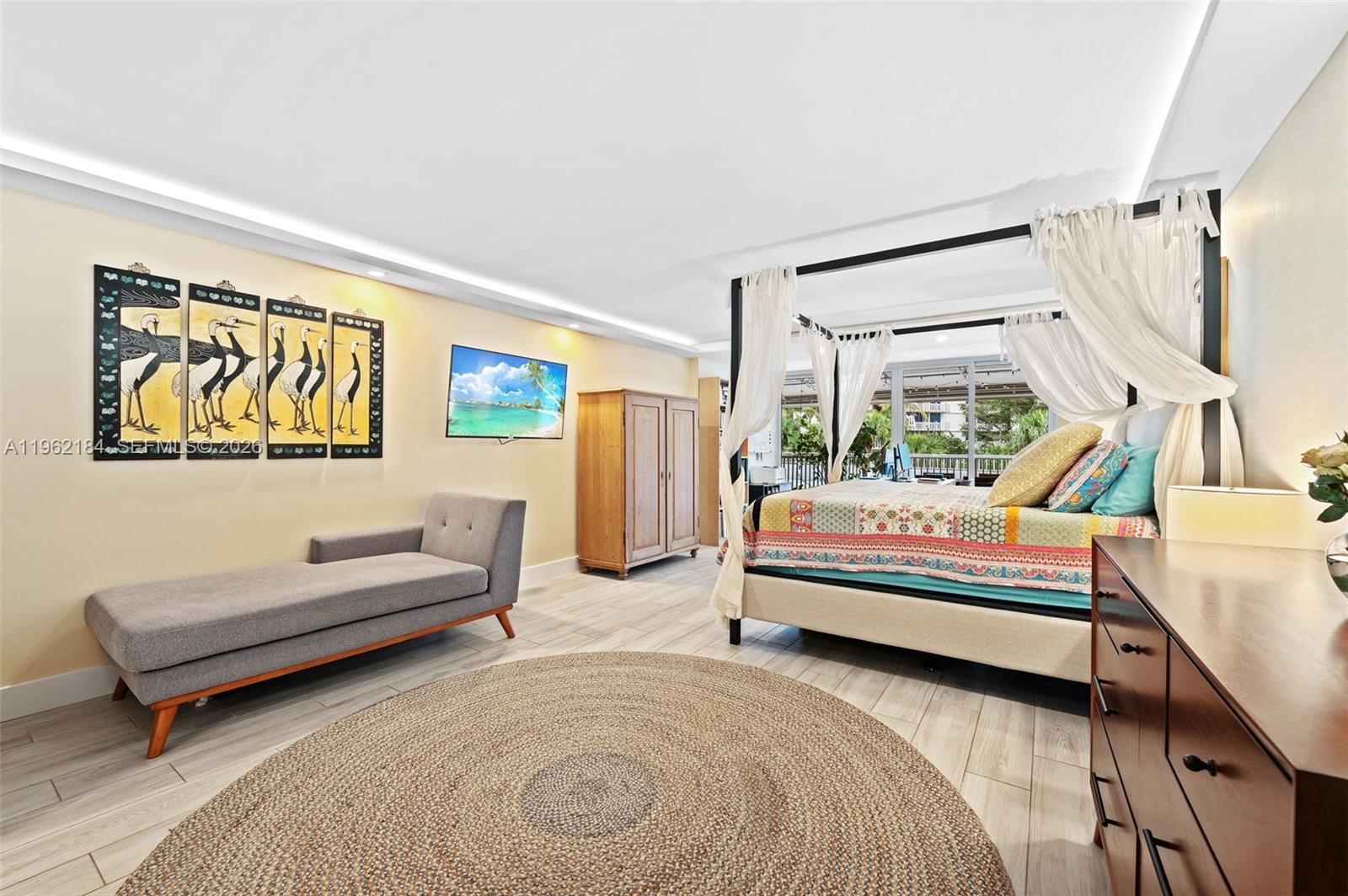 600 Grapetree Drive, Unit 3DS Key Biscayne, FL 33149 - Photo 10 of 33 a bedroom with a bed and a couch