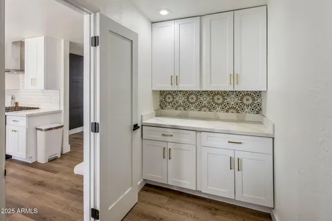 a view of cabinets with wooden floor