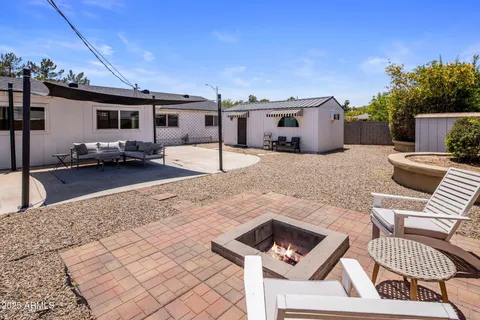 a backyard of a house with seating space