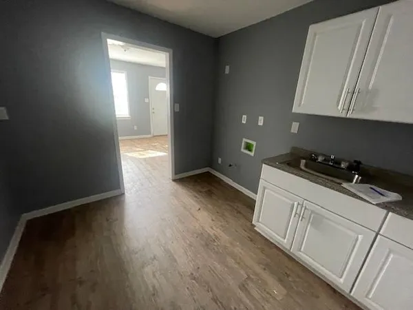 a kitchen with a sink and cabinets