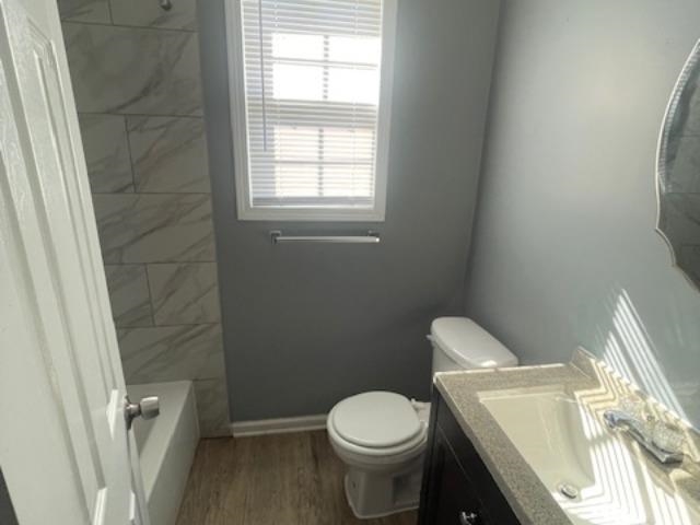 1572 Hanauer Street, Unit B Memphis, TN 38109 - Photo 9 of 11 a white toilet sitting next to a window