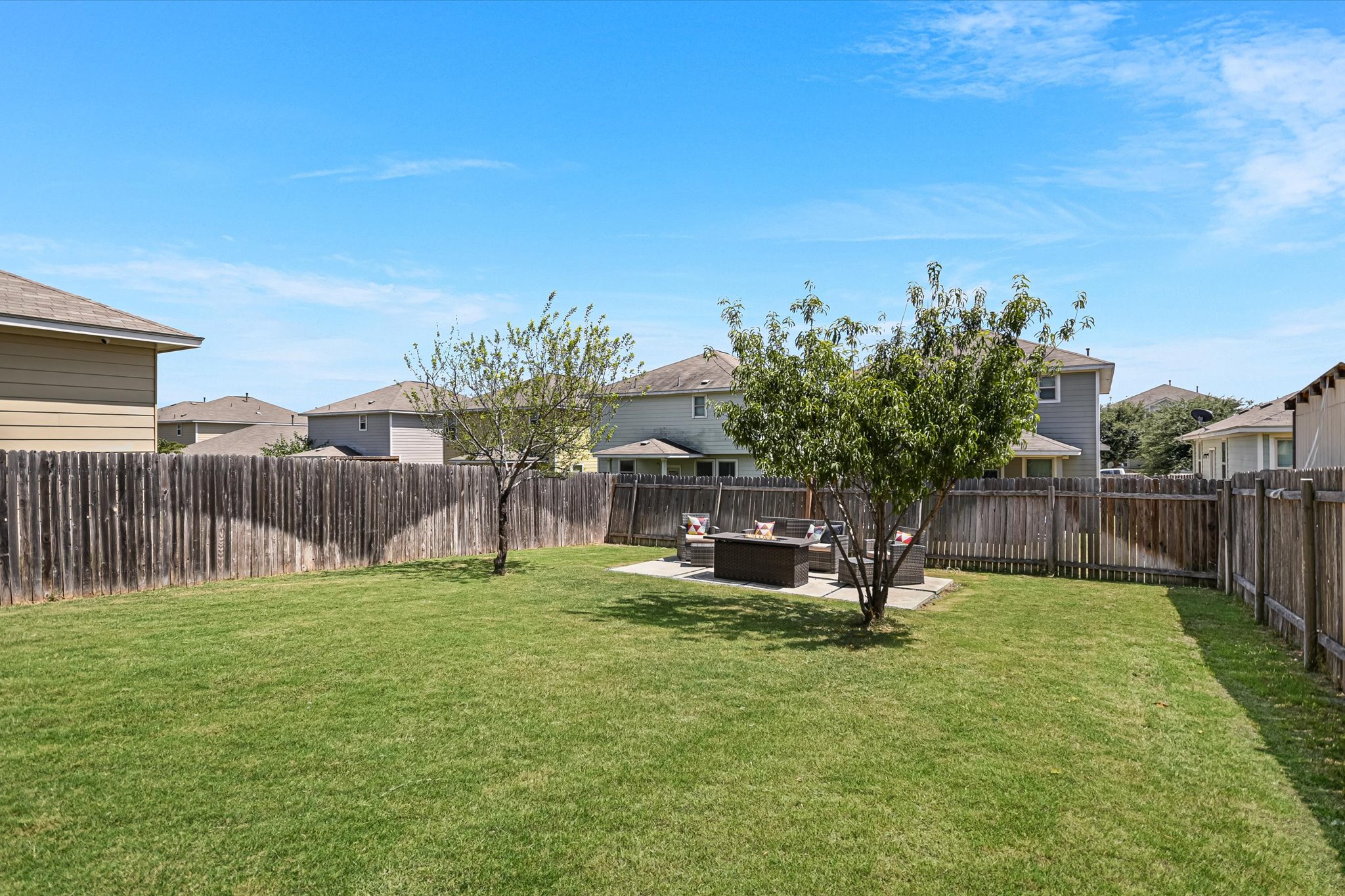225 Vestral Road Buda, TX 78610 - Photo 16 of 24 Fenced backyard offers room to relax, play or let the dog stretch their legs with a patio positioned a little further into the yard for separation from the house. Settle into the patio with a cold drink, sunscreen and let the afternoon stretch out a little longer.