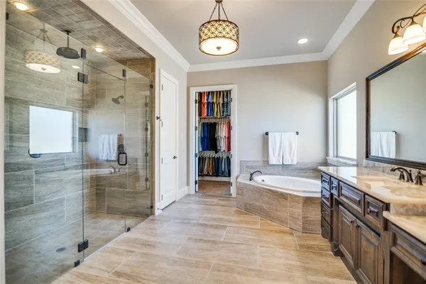 a view of a bathroom with sink shower and mirror
