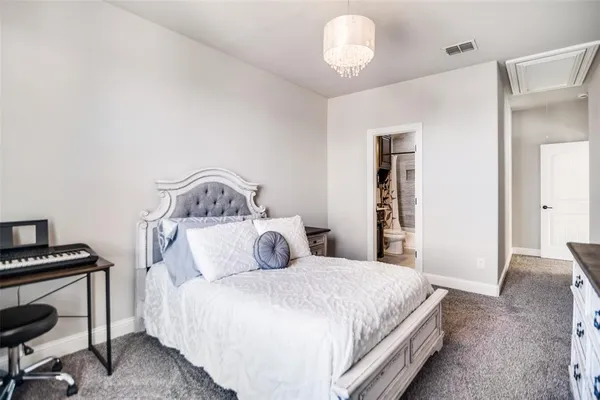 a bedroom with a bed and a table