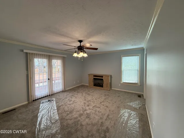 a view of empty room with windows
