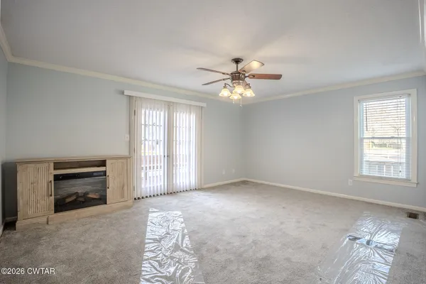 a view of an empty room with a window