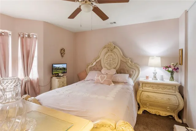 a bedroom with a bed and a chair