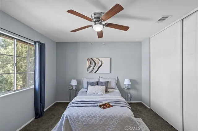 a bedroom with a bed and window