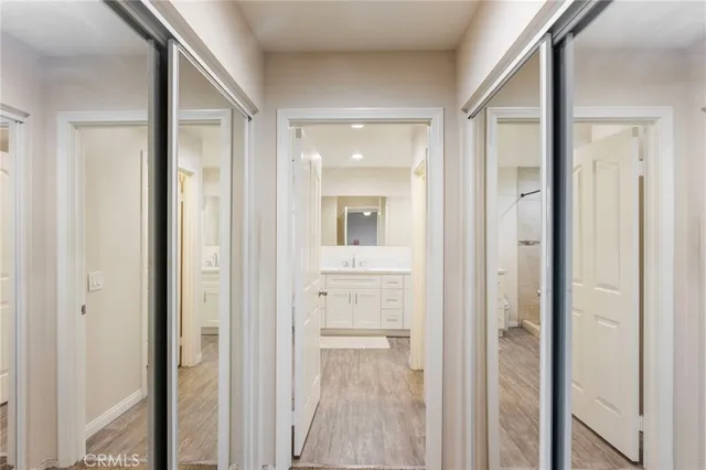 a view of a bathroom from a hallway