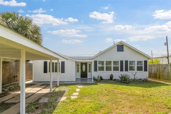 a view of a house with swimming pool and porch with furniture