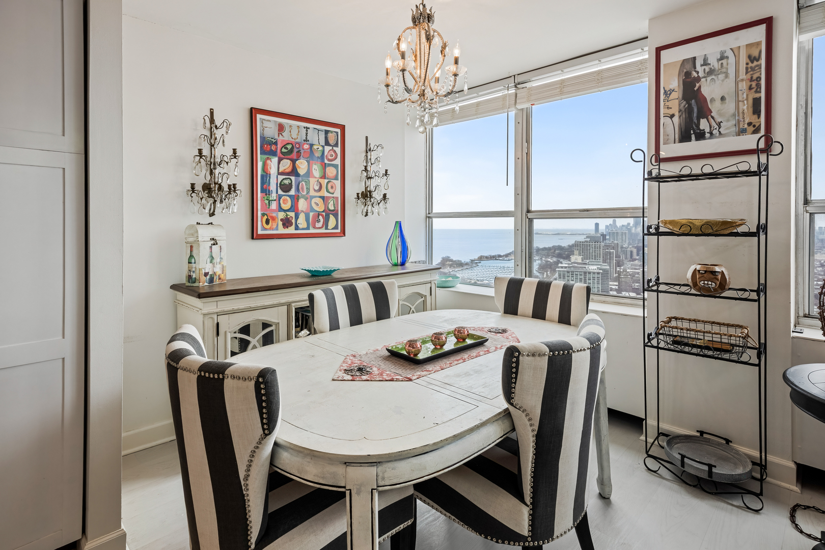 655 West Irving Park Road, Unit 5315 Chicago, IL 60613 - Photo 13 of 29 a view of a dining room with furniture window and outside view