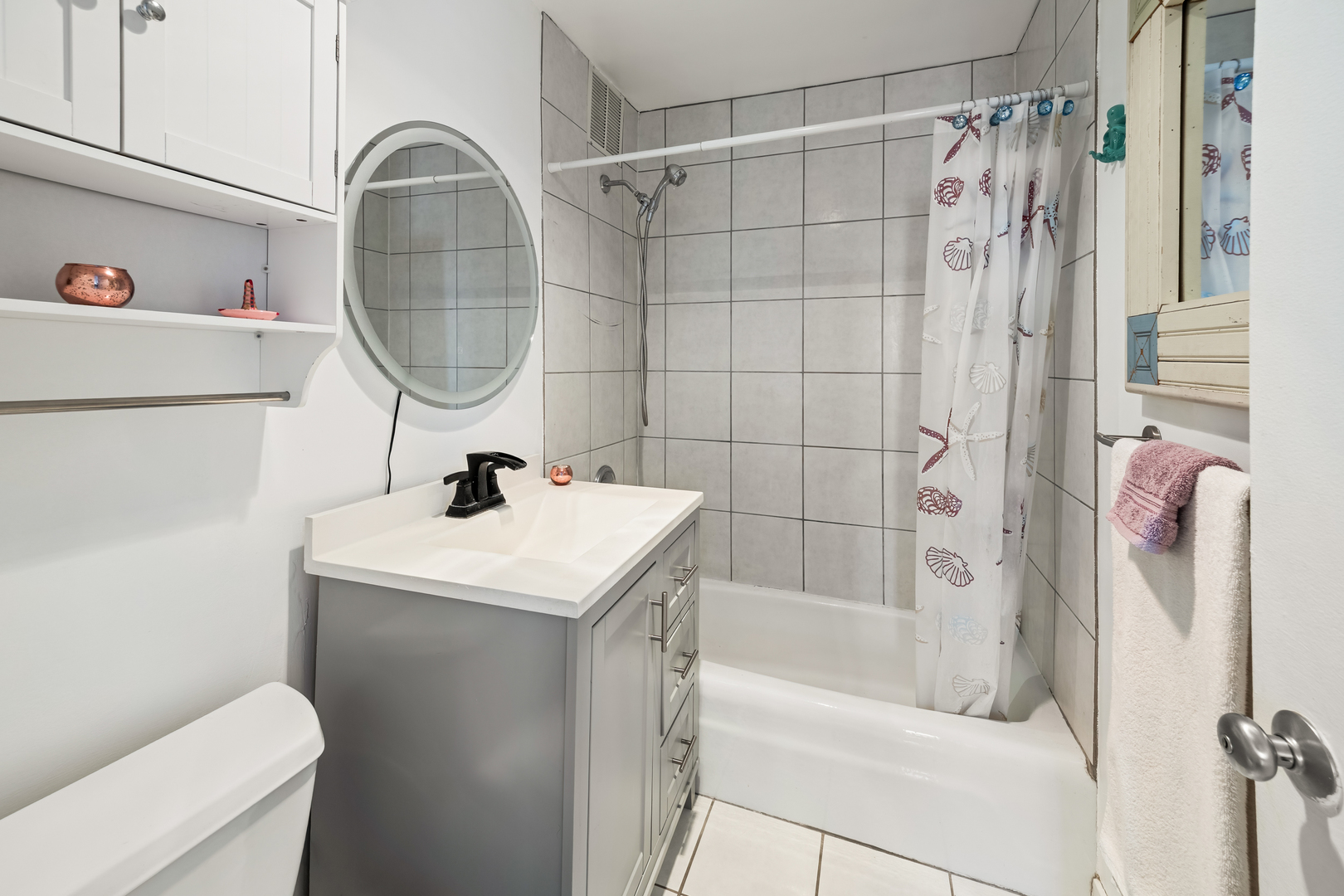 655 West Irving Park Road, Unit 5315 Chicago, IL 60613 - Photo 19 of 29 a bathroom with a sink a toilet and shower