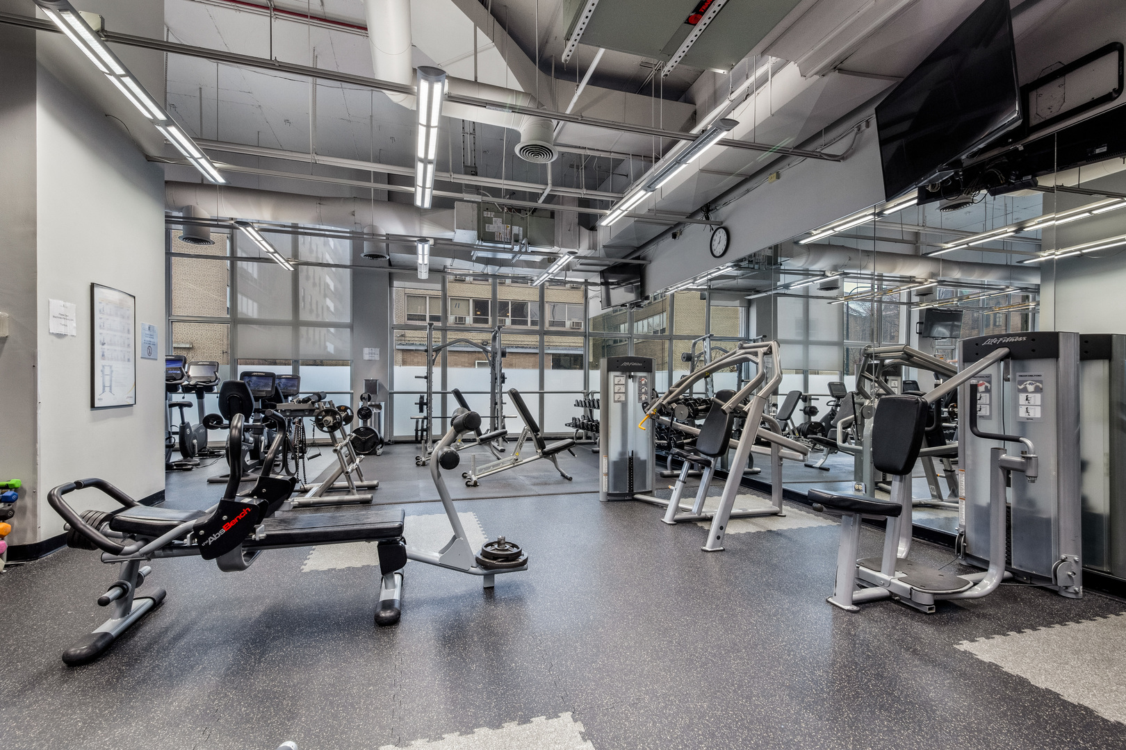 655 West Irving Park Road, Unit 5315 Chicago, IL 60613 - Photo 23 of 29 a view of a room with gym equipment