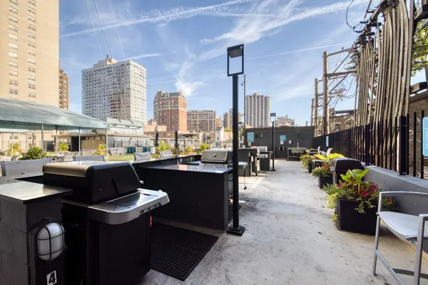 a terrace with outdoor seating and city view
