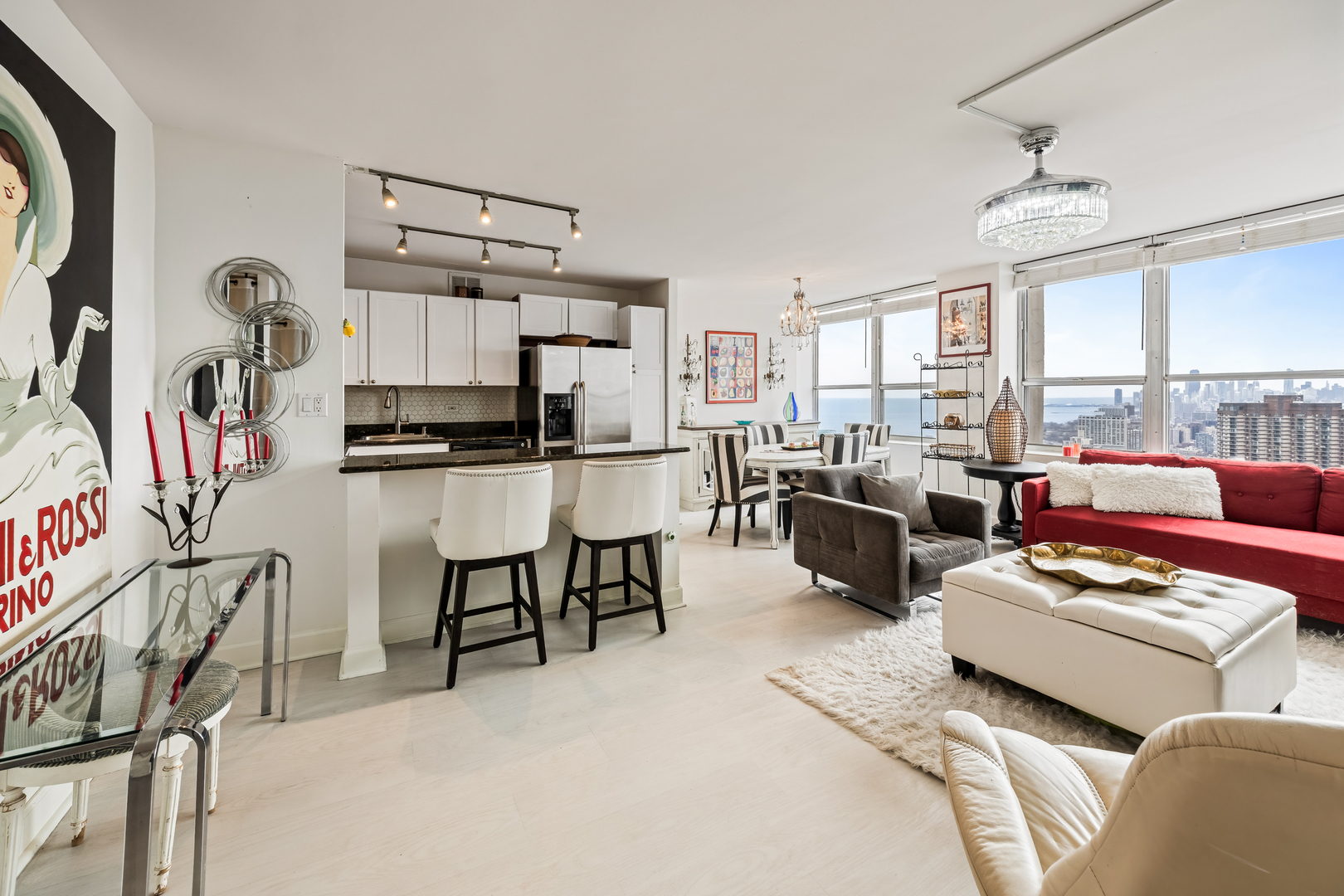 655 West Irving Park Road, Unit 5315 Chicago, IL 60613 - Photo 4 of 29 a living room with furniture and a flat screen tv
