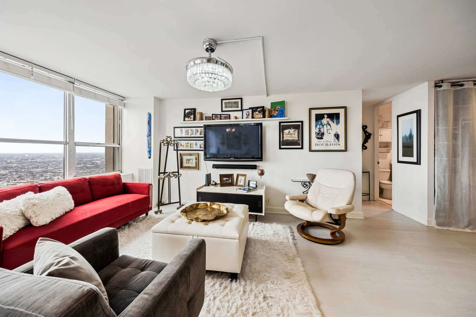 655 West Irving Park Road, Unit 5315 Chicago, IL 60613 - Photo 6 of 29 a living room with furniture kitchen view and a window