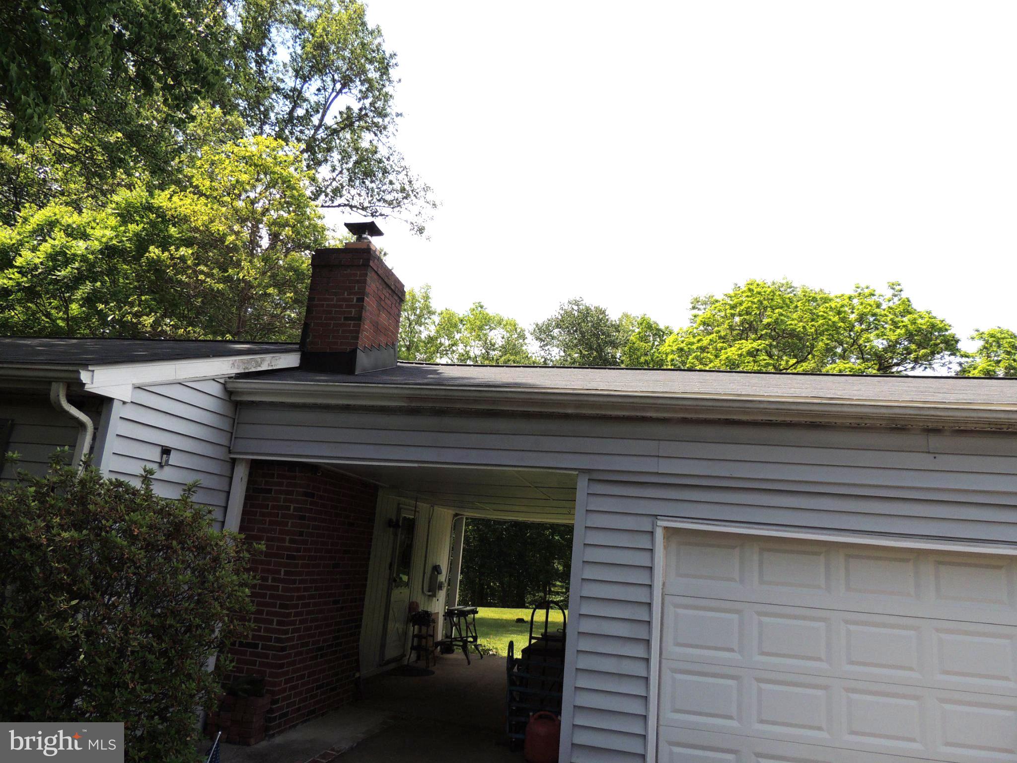 5838 Oklahoma Road Sykesville, MD 21784 - Photo 72 of 72 Charming home with lush greenery backdrop.
